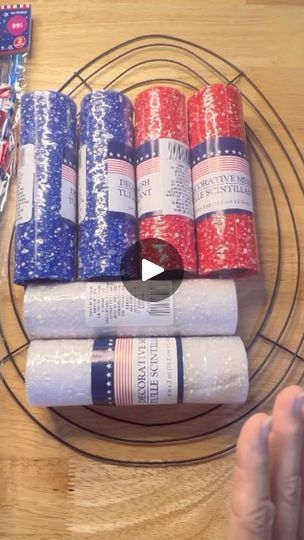 several rolls of toilet paper sitting on top of a wire rack next to candy bars