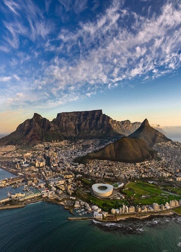 an aerial view of cape town with table mountain in the background