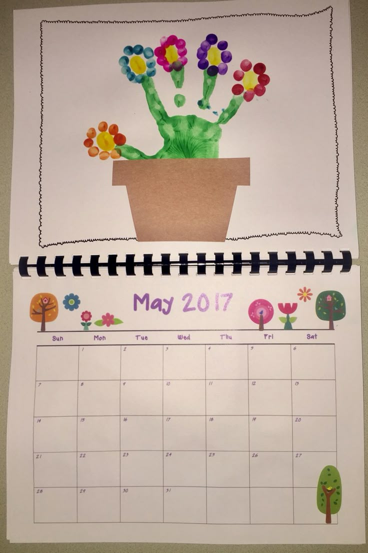 a calendar with flowers in a pot on it