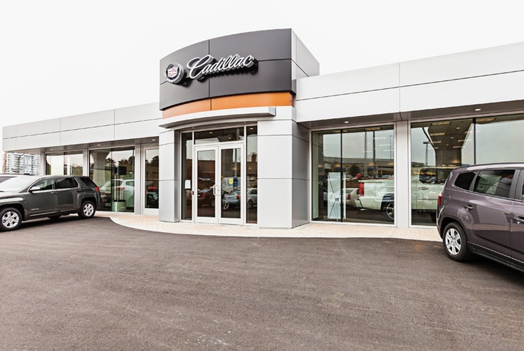 a car dealership with cars parked in the lot