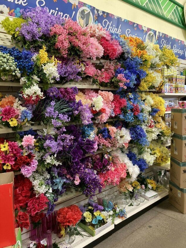 flowers are on display in a store for the price of one piece or two dollars