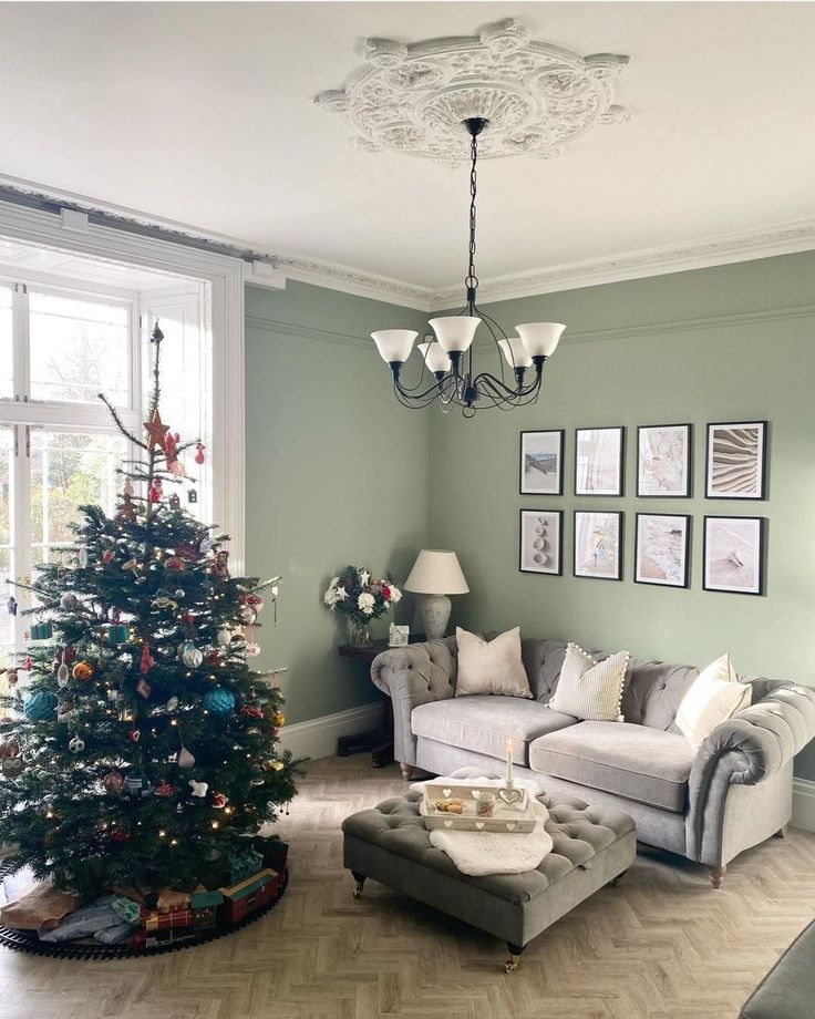 a living room filled with furniture and a christmas tree