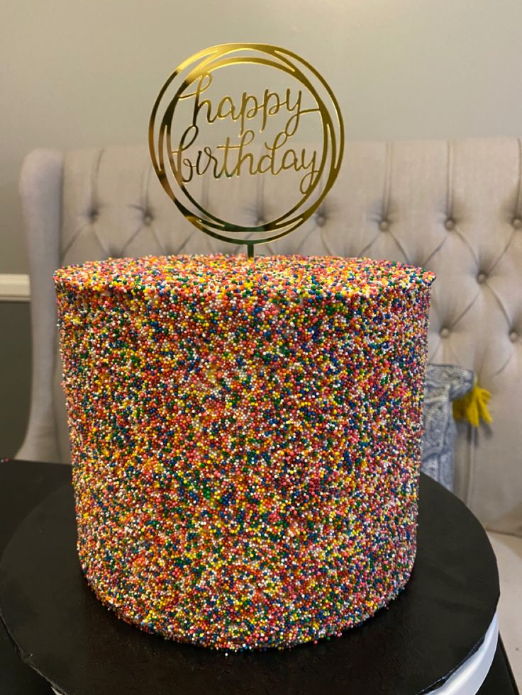 a birthday cake with colorful sprinkles on top