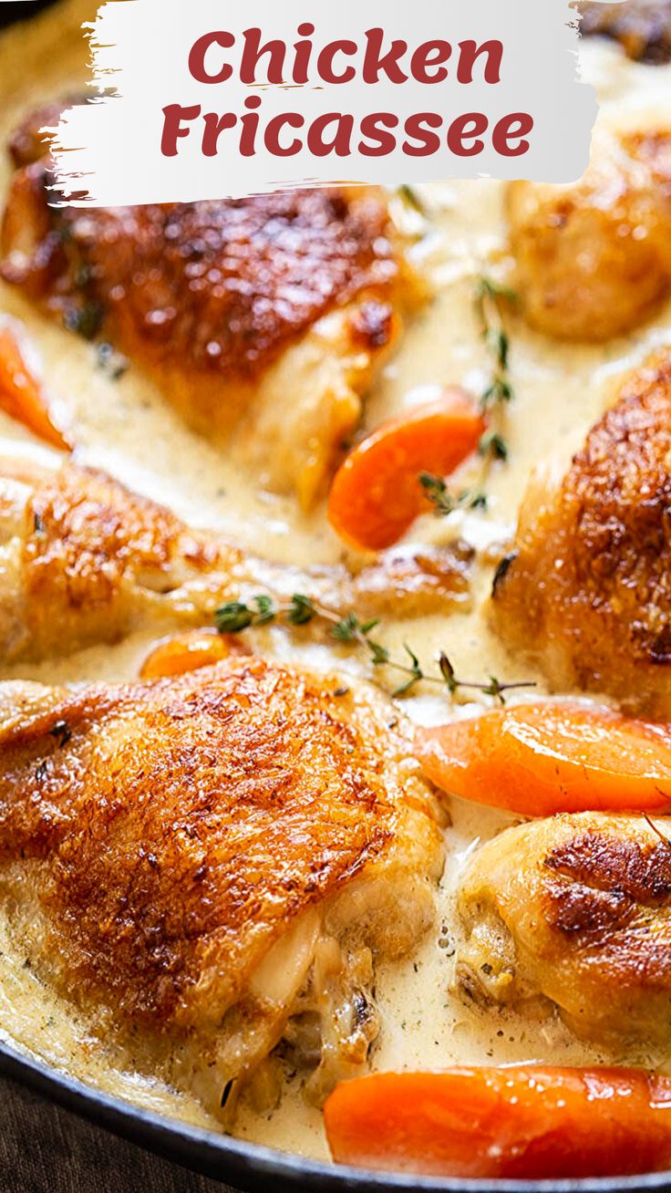 a pan filled with chicken and carrots covered in cream sauce