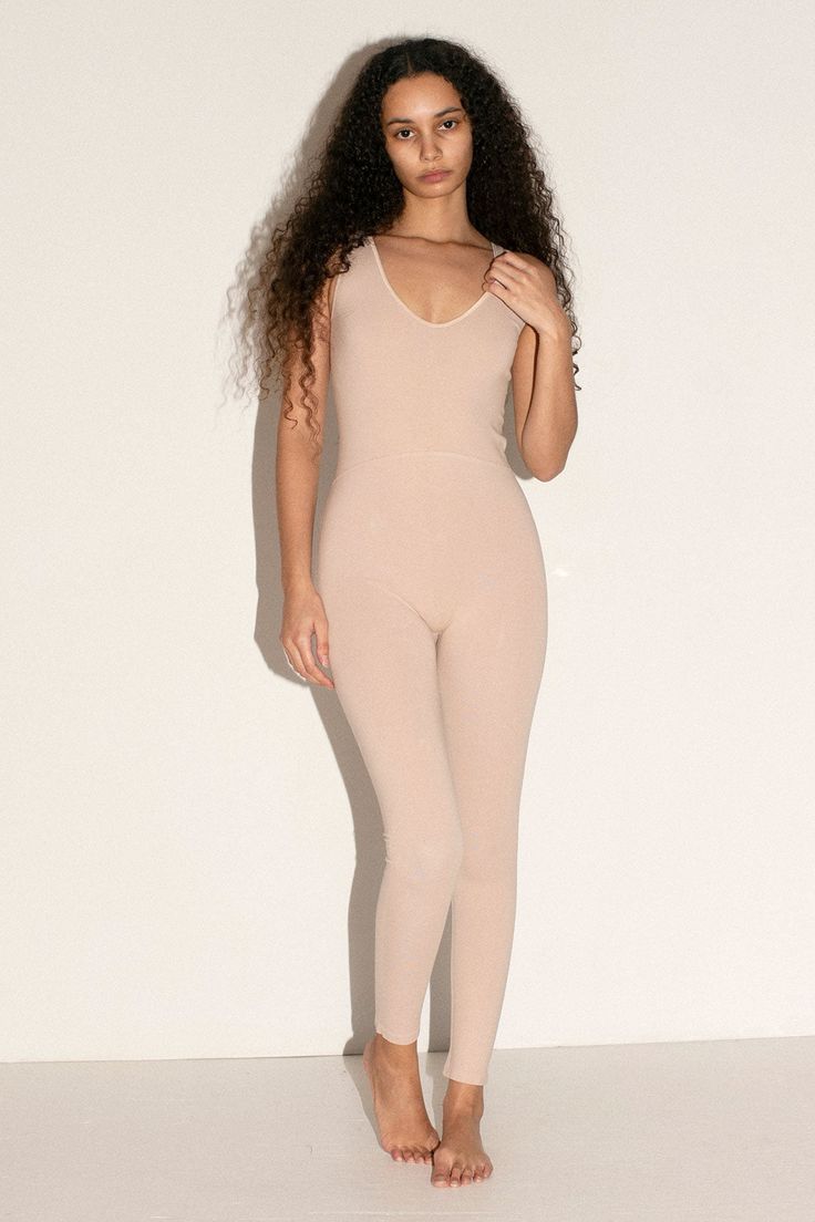 Stretchy cotton jumpsuit with a rounded V neckline. Slightly lower in back. Fitted and stretchy but soft and lightweight and not at all constricting. Fabric is 84% cotton, 11% polyamide and 5% elastane. Tiara is 5'6", bust 32", waist 26", hip 36", and is wearing a size XS/S Chic Full Length Jumpsuits And Rompers For Loungewear, Spring Elastane Bodysuit For Loungewear, Bodycon Elastane Bodysuit For Loungewear, Chic Full Length Stretch Bodysuit, High Stretch Summer Loungewear Jumpsuits And Rompers, High Stretch Jumpsuits And Rompers For Summer Loungewear, Spring Bodycon Bodysuit For Loungewear, Chic Stretch Jumpsuits And Rompers For Loungewear, Spring Bodysuit For Loungewear