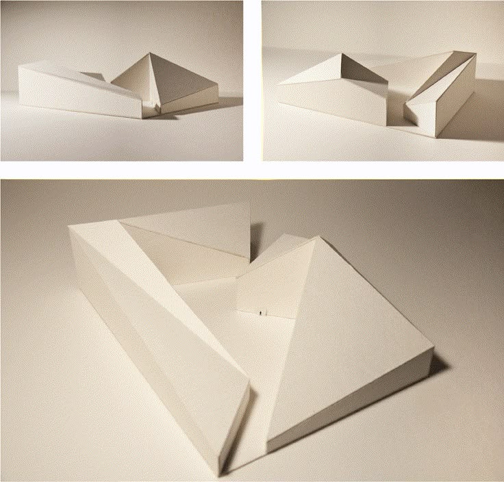 three different angles of an origami house