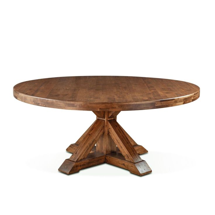 a round wooden table with four leaves on the top and one leaf at the base