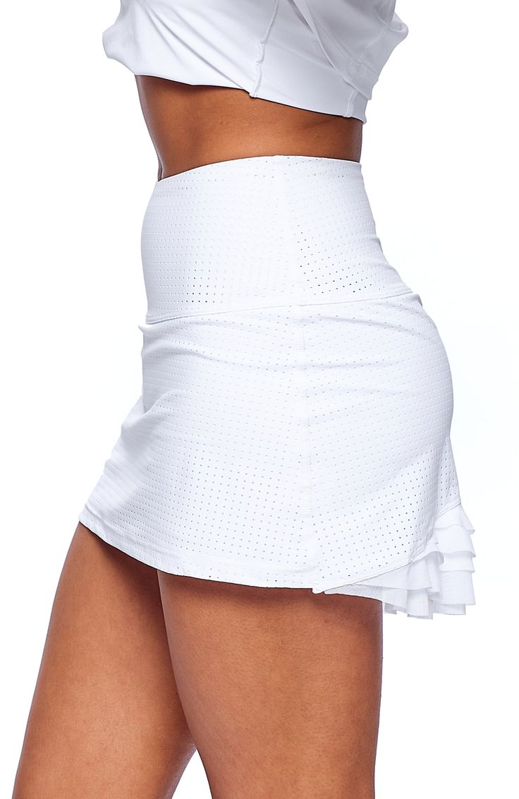 Color: Cloud White Description: The Cute As A Bunny Skirt is the perfect blend of fun and functionality with just the right amount of girlie! High-waisted and court-ready with an a-line silhouette and layers of flirty mesh at the back to finish. A comfy inner short and lightweight feel make this one a must-have for tennis season and beyond. Comfy inner short Designed & uniquely fit to flatter every size Layers of flirty mesh in back FIT True to size A-line silhouette and high waisted Model is 5’