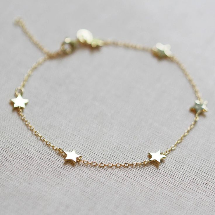 Our star bracelet is the perfect celestial addition to your bracelet stack. It features six tiny little stars that hang along delicate chain. DETAILS 6 inches long with 2 inch extender gold vermeil or .925 sterling silver Silver Star Bracelet, Stars Bracelet, Lunar Jewelry, Gold Bracelet Simple, Small Stars, Cheap Bracelets, Preppy Jewelry, Gold And Silver Bracelets, Small Bracelets