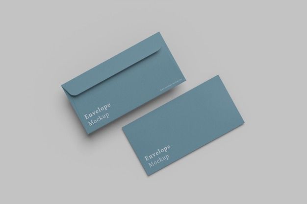 two blue business cards sitting next to each other on top of a gray surface with white lettering