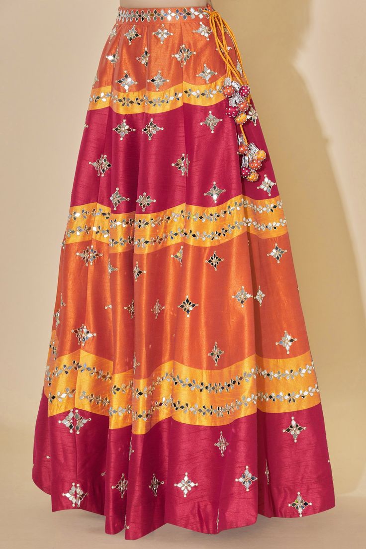 Orange high-waist lehenga with mirror embellished motifs. Comes with blouse and sheer dupatta.
Components: 3
Fabric: Dupion Raw Silk
Neckline: Scoop
Sleeve Length: Sleeveless
Color: Orange
Embellishment
Stone and mirror embellished motifs on blouse
Deep back on blouse with tassel tie-up detail
Printed motifs on dupatta
Mirror motifs on dupatta
Mirror embellished motifs on dupatta border
Side tassel tie-up detail on lehenga
Closure:
Blouse: Concealed side zip placket
Lehenga: Concealed side zip p Sheer Dupatta, Dupatta Border, Raw Silk Lehenga, Bridal Lehengas, Silk Lehenga, Bridal Lehenga, Raw Silk, Set For Women, Aza Fashion