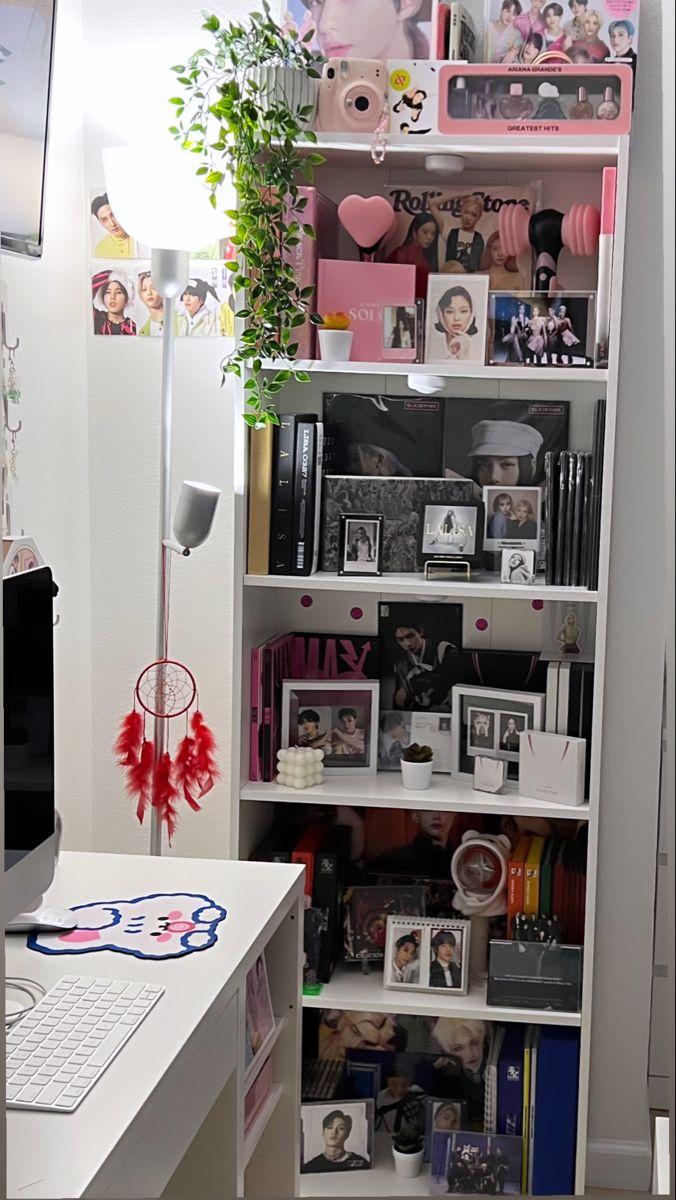 a white book shelf filled with lots of books