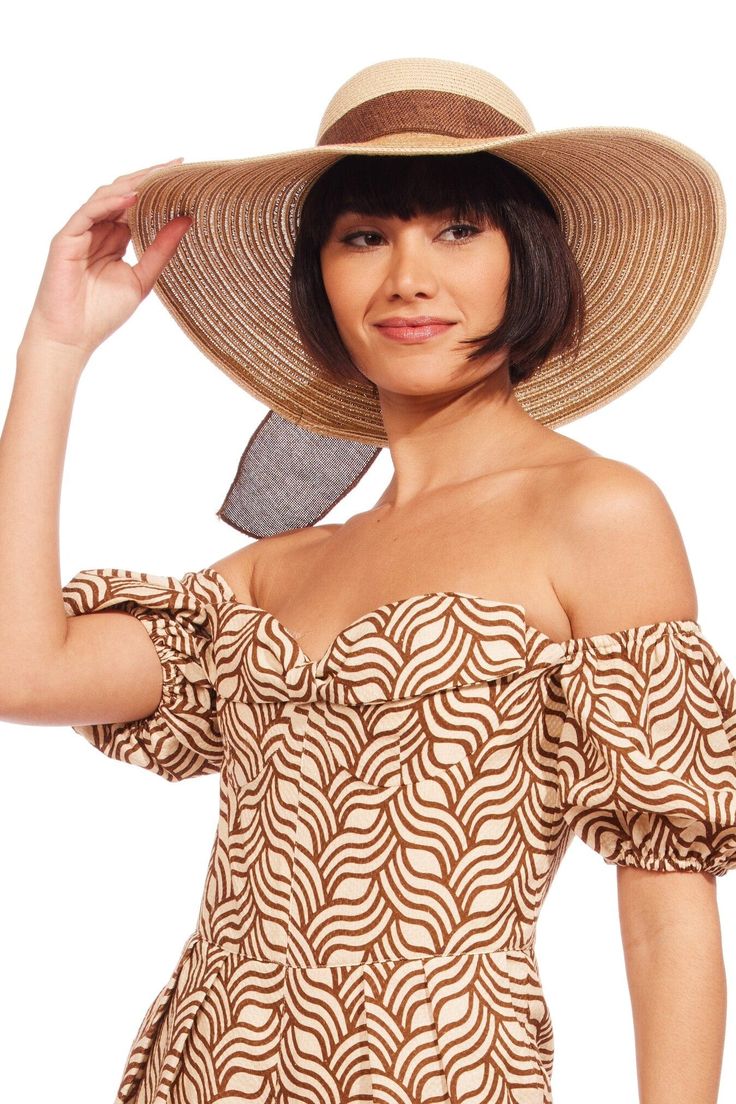 This brown and natural beige braided sun hat with bow adds instant style and functionality to your warm weather look! Chic Woven Straw Hat For Day Out, Chic Straw Boater Hat With Upf 50+, Chic Beige Woven Hat, Chic Woven Sun Hat With Wide Brim, Chic Woven Sun Hat With Curved Brim, Chic Straw Sun Hat For Vacation, Chic Woven Wide Brim Sun Hat, Chic Toquilla Straw Sun Hat With Upf 50+, Chic Straw Sun Hat With Upf 50+