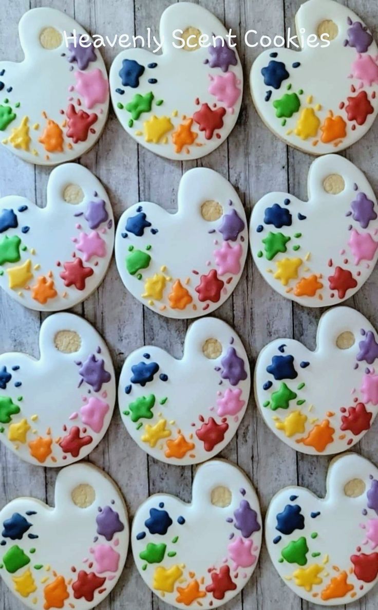 decorated heart shaped cookies with paint splattered on them