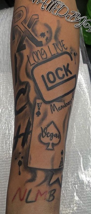 a man with a tattoo on his leg that says lock and has many other things in it