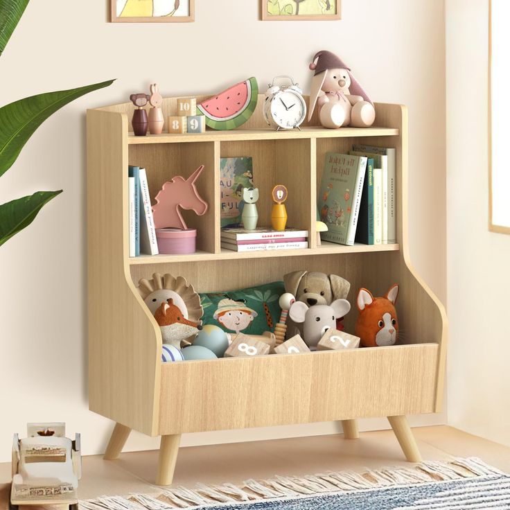 a book shelf with stuffed animals and books on it in a child's room