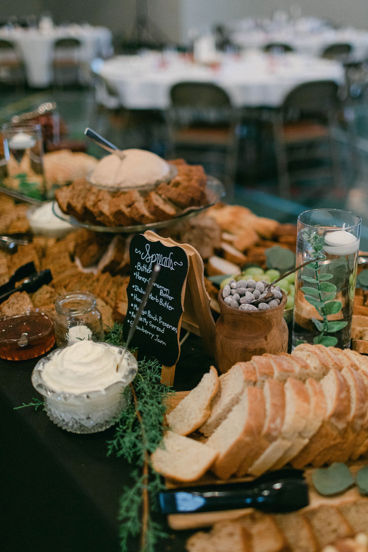 an assortment of breads and other food items on a table