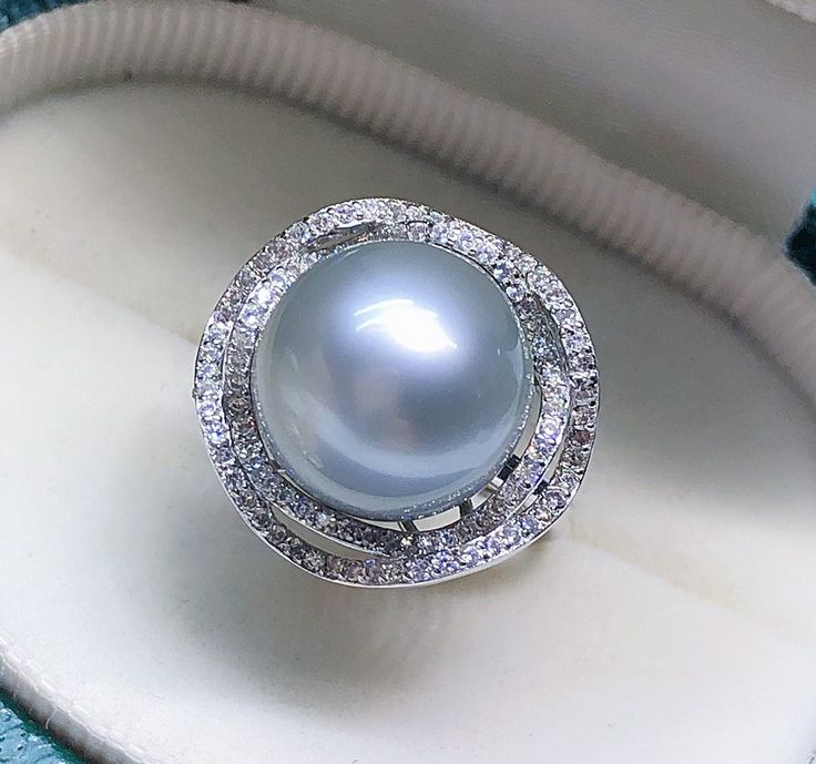 Stunning Tahitian Pearl Ring, 12.7mm, Beautiful Intense light Silvery Grey Color, High Luster.   Sterling Silver S925 with sparkling cubic zircons, Very Well made and Comfortable to wear. Open End Ring, fits US Size 6-8.  Classic and Elegant   Lustrous Beauty  Pearl ★ Pearl: Genuine Tahitian pearl, Saltwater  ★ Size: 12.7mm ★ Shape: Round ★ Color: Natural untreated, Intense light Silvery Grey Color, Beautiful ★ Luster: High Luster, Wonderful  ★ Surface: Nice, Baby Smooth and Mirror Like, Mostly Classic Pearl Jewelry, Clean Rings, Tahitian Pearl Ring, South Sea Pearls, Tahitian Pearls, Tahiti, Pearl Ring, Solitaire Ring, Metal Rings