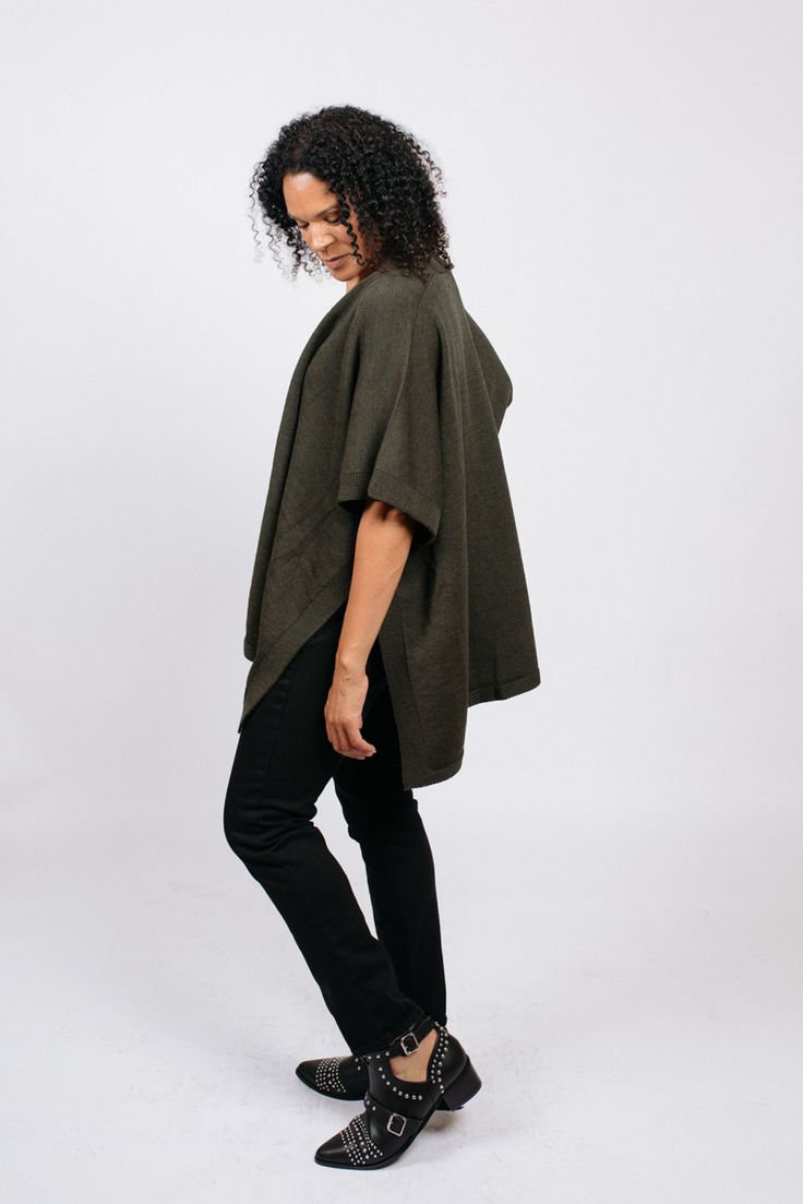 The Amanda poncho is a versatile and timeless piece that is perfect for fall and winter. While it feels like wearing a blanket, it looks runway chic. It's easy to throw on and instantly gives any simple outfit a stylish edge. We paired the poncho with a simple pair of jeans and a tank, and voila! A stylish fall outfit. When paired with the Zoe tank and the Denise skirt, this piece takes on a whole new look. And did we mention it is incredibly comfortable? Oversized Chic Wool Poncho, Oversized Winter Poncho For Work, Oversized Winter Workwear Poncho, Winter Workwear Oversized Poncho, Chic Oversized Poncho Cape, Chic Oversized Cape Poncho, Chic Fall Poncho Cape, Fall Workwear Poncho Cape, Chic Oversized Outerwear With Batwing Sleeve