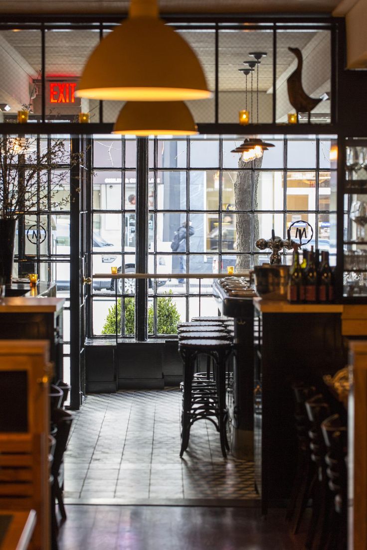 the inside of a restaurant with tables and chairs