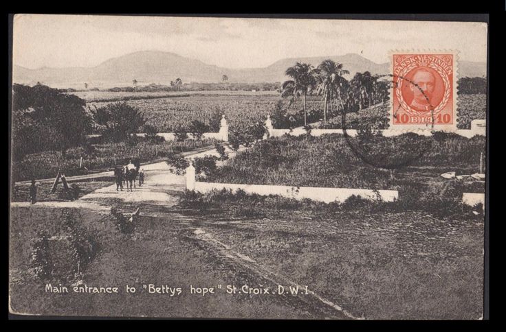 an old black and white photo shows people walking on a path in the middle of a field