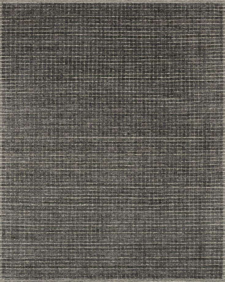 an area rug with grey and white stripes on it, in the shape of a rectangle