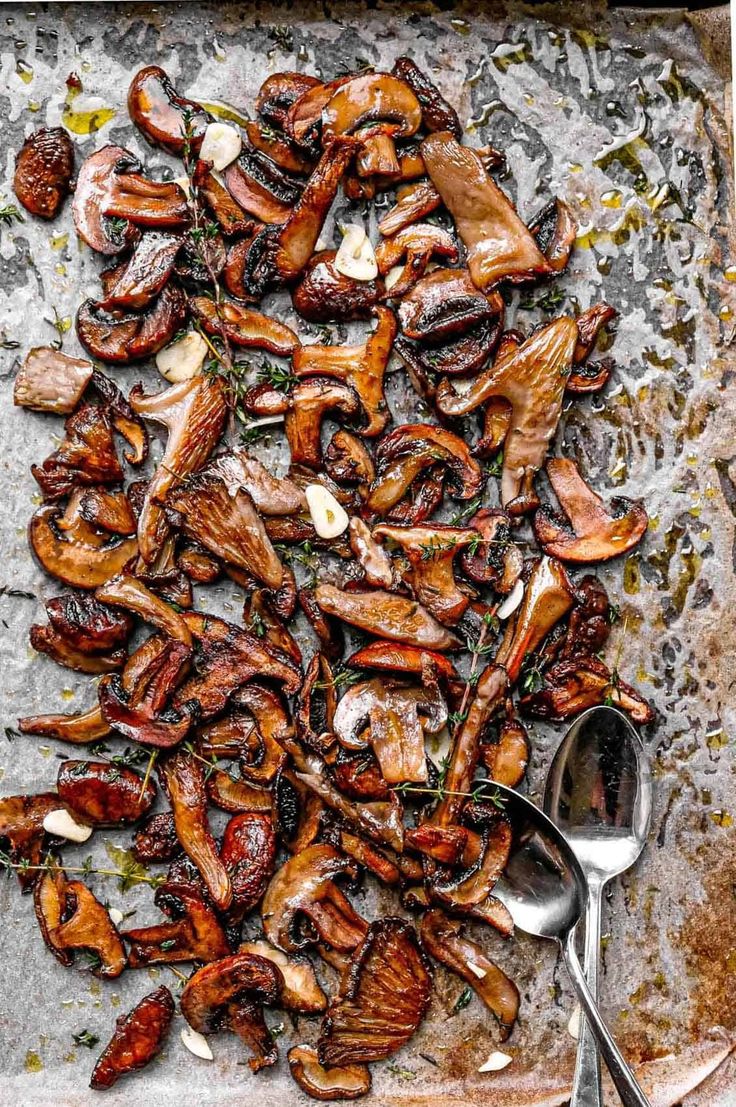 the food is prepared and ready to be eaten on the grilling sheet with utensils