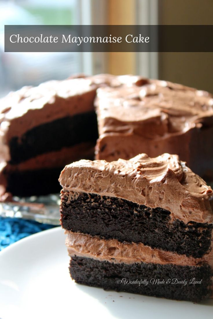 chocolate mayonnaise cake on a plate with one slice cut out and ready to be eaten