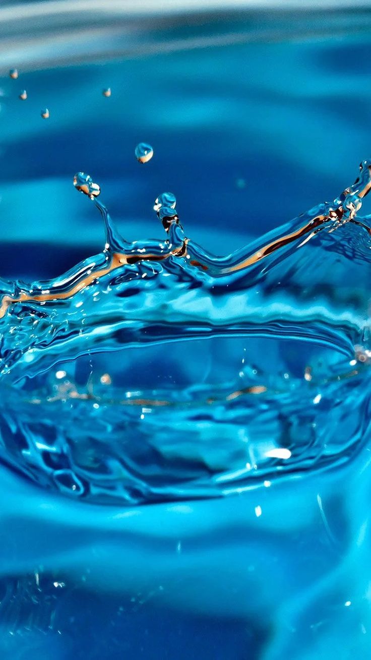 water splashing on the surface with blue background