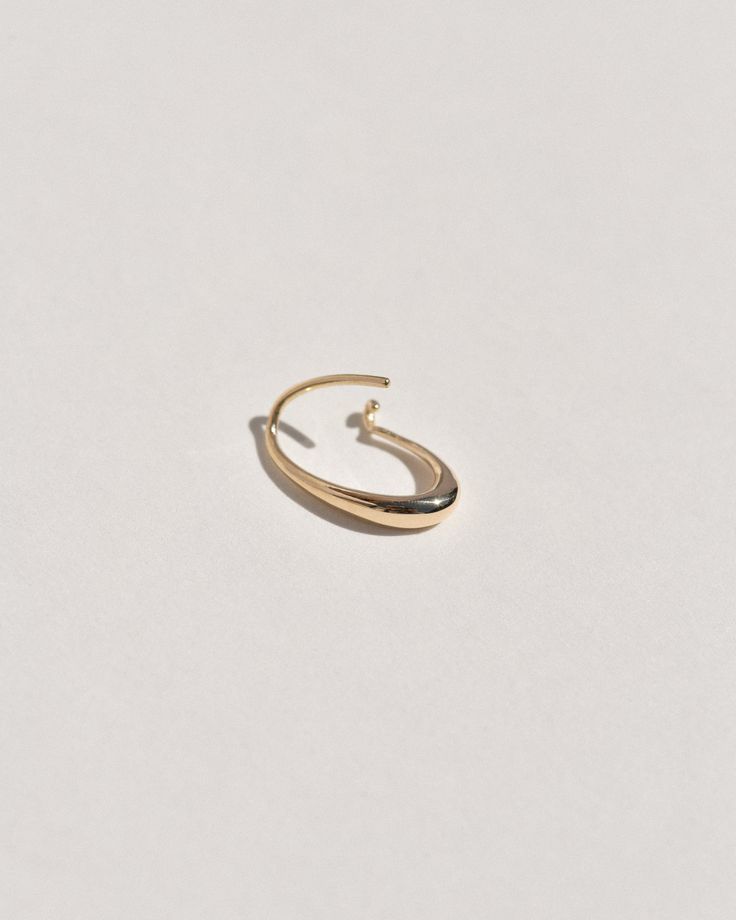 A semi-permanent style, the Sempre Hoop is part of a new offering of Leigh Miller that is designed to be worn everyday- or 'sempre'- which means always in Portuguese and Italian. This sculptural, solid gold hoop is intended to be put in, and never taken off. Wear it in the shower, in the pool or to sleep. Simply slide it in and fold the arm into its hook. Leigh was inspired to design this series to be the perfect huggers to compliment the rest of our sculptural earrings. The Sempre is ideal for Minimalist Oval Hoop Earrings For Anniversary, Modern 14k Gold Oval Hoop Earrings, Modern Oval 14k Gold Hoop Earrings, Oval 14k Gold Hoop Earrings Timeless Style, 14k Gold Oval Hoop Earrings Timeless Style, Modern Yellow Gold Oval Link Hoop Earrings, Timeless Oval 14k Gold Hoop Earrings, Timeless 14k Gold Oval Hoop Earrings, 14k White Gold Oval Hoop Earrings