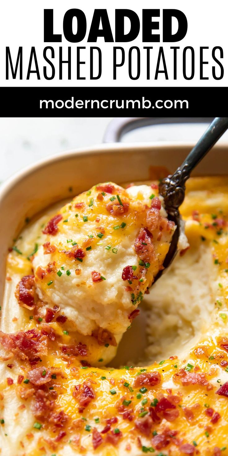 loaded mashed potatoes in a casserole dish with a spatula scooping out