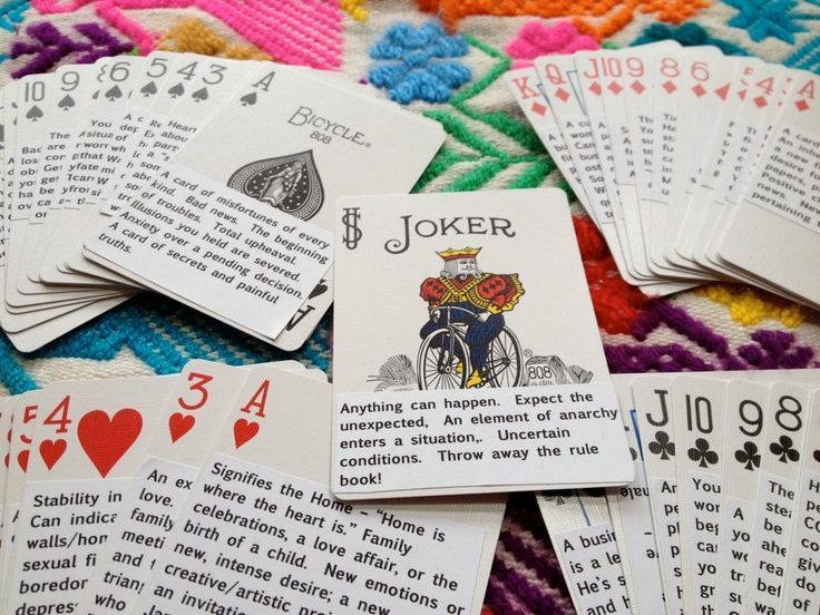 playing cards are laid out on a blanket