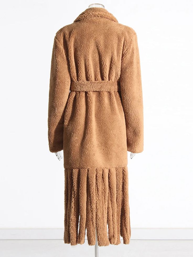 With its cozy fringe detailing, this fashionable coat is perfect for any cold-weather looks. Material: Faux Fur, polyester, cotton Closure Type: Belt Long Winter Outerwear With Tassels, Long Winter Outerwear With Fringe, Long Fringed Outerwear For Winter, Long Fringe Outerwear For Winter, Casual Long Fringe Outerwear, Long Fall Outerwear With Tassels, Chic Outerwear With Fringe, Chic Long Sleeve Outerwear With Fringe, Brown Tasseled Outerwear For Fall