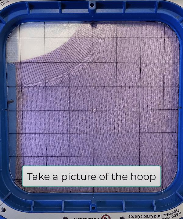 there is a blue frame with a purple sweater on it that says take a picture of the hoop