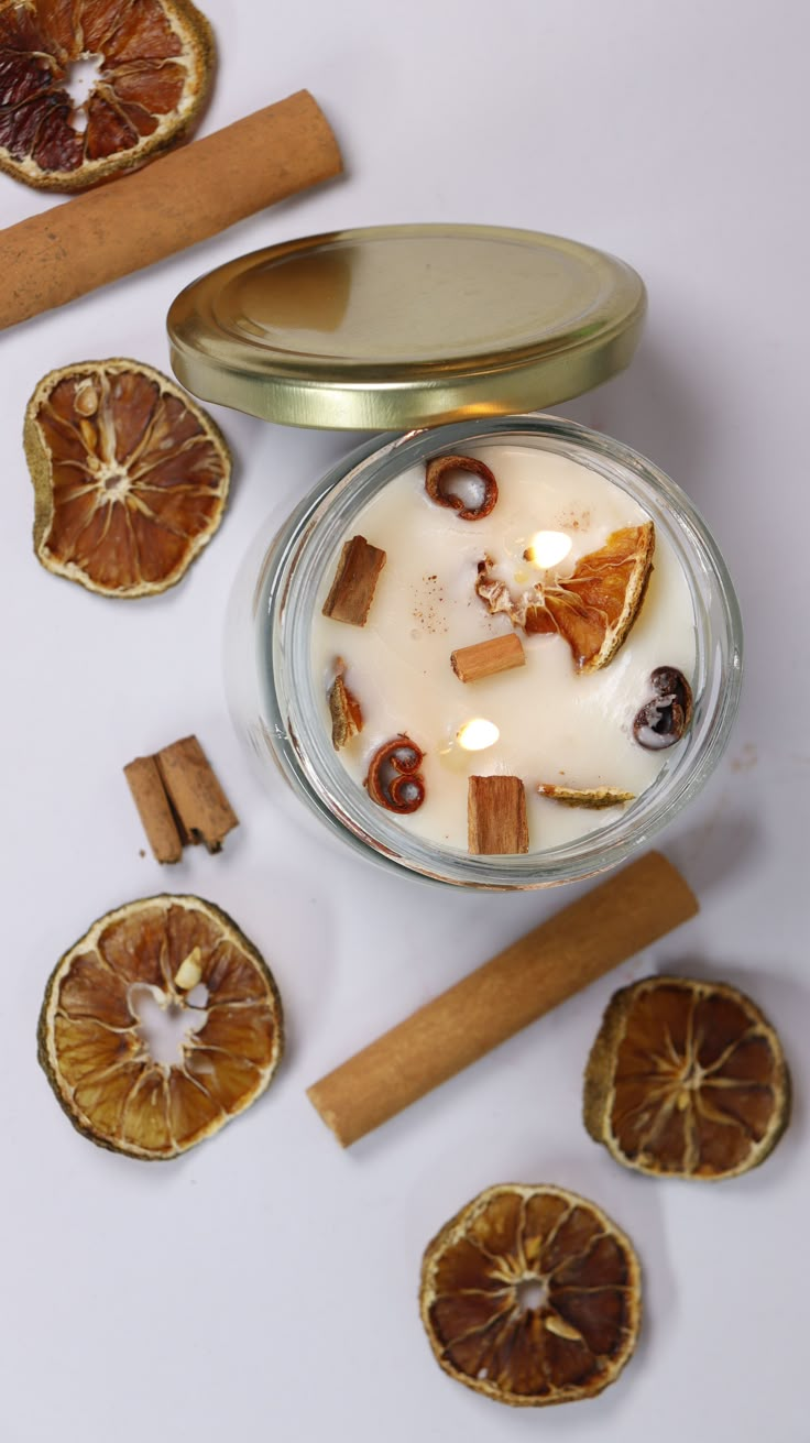 Make a Sweet-Smelling Cinnamon and Orange Candle for All-Year Christmas Vibe Apple Cinnamon Candles Diy, Orange Peel Candle Diy, Homemade Orange Candles, Dried Orange Candles, Cinnamon Stick Candles Diy, Diy Beeswax Candles Wood Wick, Chai Candle Diy, Diy Candles With Dried Fruit, Diy Healthy Candles