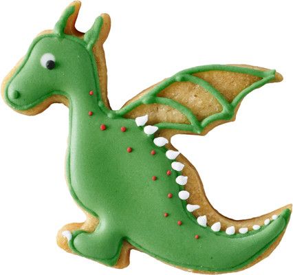 a cookie shaped like a dragon with green icing