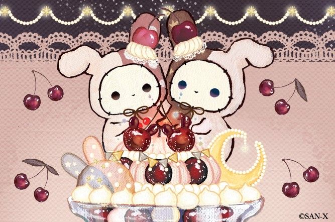 two teddy bears sitting on top of a cake with cherries in the bowl next to it