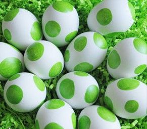 green and white polka dot eggs in a basket