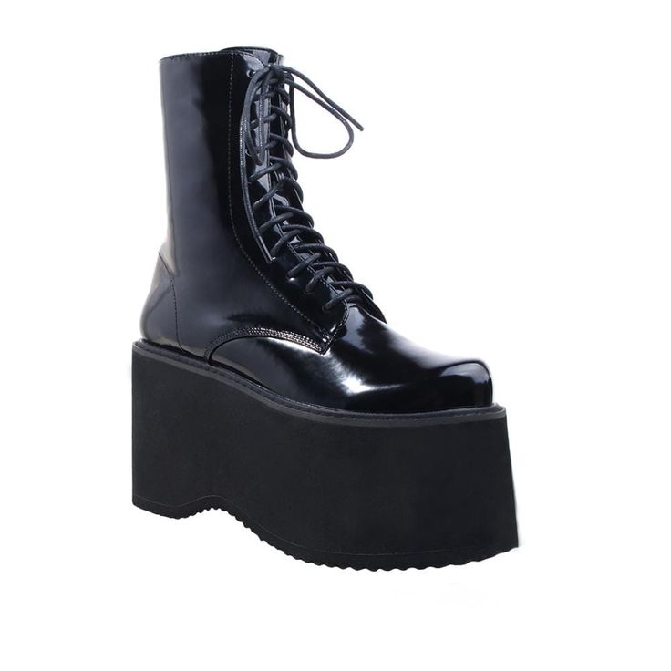 Vegan leather upper with man made sole Side zipper closure Platform measures approx. 4.25" H Imported