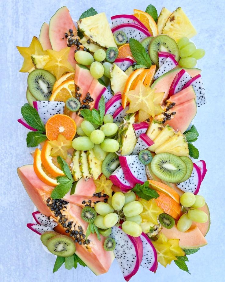 a bunch of fruit is arranged in the shape of a flower