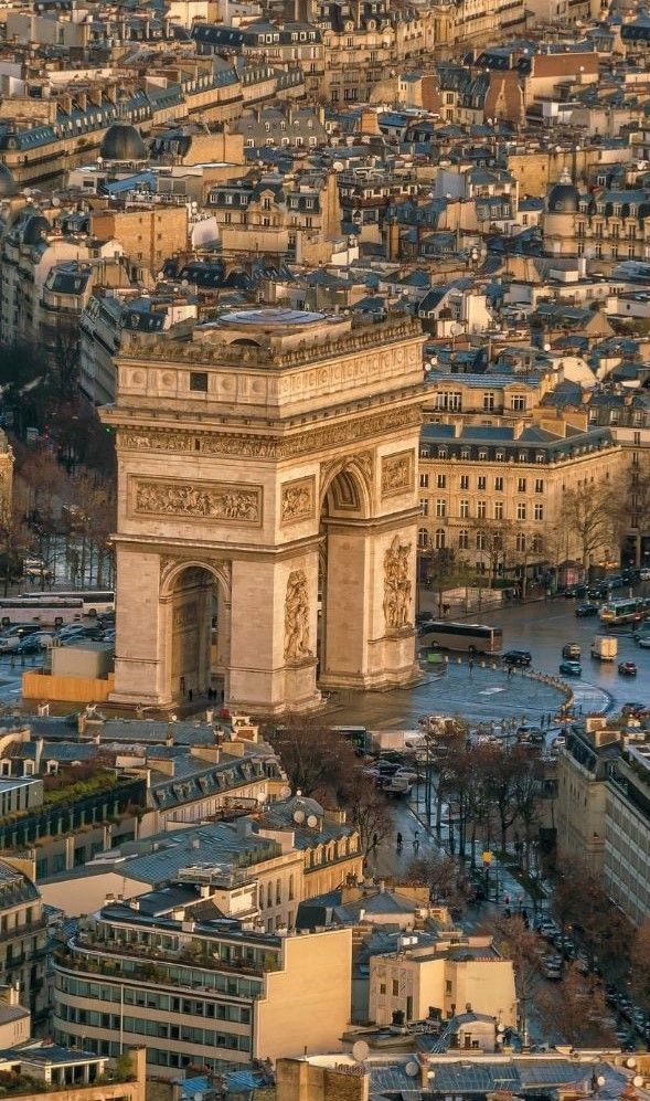 an aerial view of the eiffel tower and surrounding buildings in paris, france