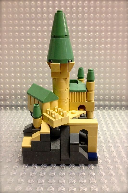 a lego castle made out of yellow and green bricks