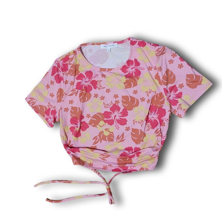 Sweet Tropical Topics Hibiscus Top Cuz We Wanna Be At The Beach. This Cropped Tee Has Short Cap Sleeves, An Open Back With A String Tie, And A Hibiscus Floral Print All Over. Pink 95% Polyester, 5% Spandex Hand Wash Cold, Hang Dry Vacation Floral Print Short Sleeve Crop Top, Vacation Crop Top With Floral Print And Short Sleeves, Floral Print Short Sleeve Crop Top For Vacation, Pink Tropical Top With Floral Print, Tropical Pink Top With Floral Print, Pink Beachwear Crop Top For Spring, Summer Pink Tops With Floral Print, Pink Floral Print Top For Summer, Fitted Tropical Floral Print Top