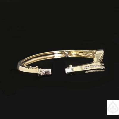 Description: A vintage cuff made of 14K gold with diamonds set in it. Specifications: Metal: 14K gold Stone: Diamonds Item Code: 889407 Diamond Accents Cuff Bracelet For Formal Occasions, Formal Cuff Bracelet With Diamond Accents, Formal Diamond Accented Cuff Bracelet, Formal Diamond Bangle With Polished Finish, 14k Gold Brilliant Cut Bangle For Wedding, Exquisite Diamond Bangle For Formal Occasions, Elegant Yellow Gold Cuff Bracelet With Diamond Accents, Elegant Cuff Bracelet With Diamond Accents For Anniversary, Wedding 14k Gold Bangle With Brilliant Cut