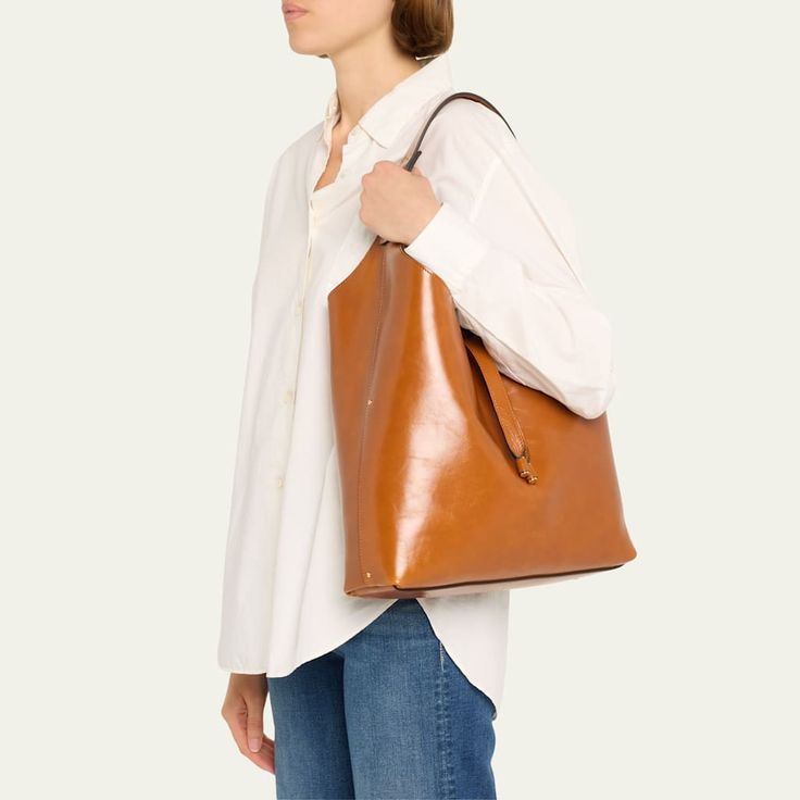 Chloe "Marcie" hobo bag in shiny calfskin  Shoulder strap  Open top with center leather straps  Interior, one zip pocket  Lining: Leather Approx. 11.4"H x 14.2"W x 3.9"D Made in Italy Designer Hobo Bag With Double Handle For Daily Use, Designer Hobo Bag With Double Handle For Errands, Luxury Brown Hobo Bag For Everyday, Designer Double Handle Hobo Bag For Errands, Designer Bags With Leather Lining, Luxury Tote Hobo Bag For Errands, Cognac Hobo Shoulder Bag For Shopping, Cognac Hobo Bag For Shopping, Luxury Cognac Shoulder Bag For Everyday