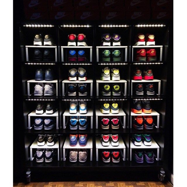 there are many pairs of shoes on display in the store's shoe storage unit