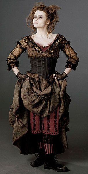 a woman dressed in an old fashion dress