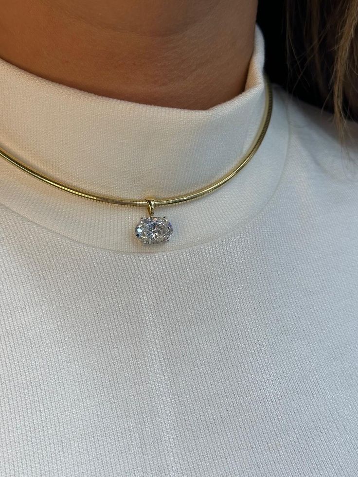 Add a touch of luxury to your look with this stunning Oval CVD Diamond Choker. Featuring a beautifully cut oval lab-grown diamond (CVD), this choker is both eco-friendly and dazzling. The sparkling CVD diamond is set in a sleek and minimalistic design, making it a perfect statement piece for any occasion. Crafted from high-quality materials, this elegant choker sits comfortably around the neck and adds an aura of sophistication to any outfit. Whether you're dressing up for a formal event or look Oval Diamond Necklace, Elegant Choker, Cvd Diamond, Diamond Choker, Minimalistic Design, Choker Necklaces, Jewelry Inspo, Oval Diamond, Collar Necklace