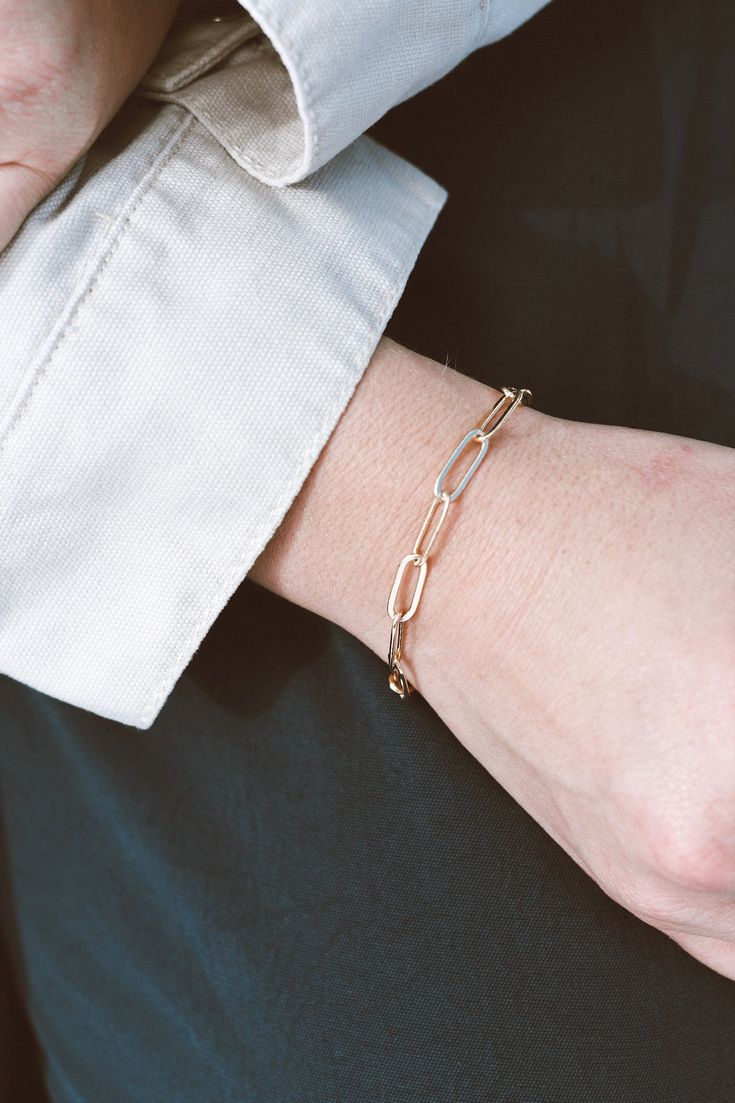 Our Paperclip Collection brings statement pieces into your everyday lineup - even if you're not a statement-jewelry-kinda-person. This beaut is lightweight & breezy while maintaining a bold presence. The Paperclip Bracelet is made from 14k Gold-Filled chain, which means you can live real life in this bracelet without fear of it turning or tarnishing. 14k Gold-Filled 7" length, one size fits most handmade in dallas, tx Hypoallergenic A tip from our team: this bracelet looks stunning paired wi Everyday Jewelry With 14k Gold Filled Box Chain, Everyday 14k Gold-filled Chain Bangle Bracelet, Everyday 14k Gold Filled Chain Bangle Bracelet, Modern Rose Gold Chain Bracelet With Rectangular Links, Modern Everyday 14k Gold Filled Bracelet, Chic 14k Gold Bracelets, Chic Everyday 14k Gold Bracelets, Everyday Elegance Jubilee Bracelet, Chic Everyday Rose Gold Bracelet