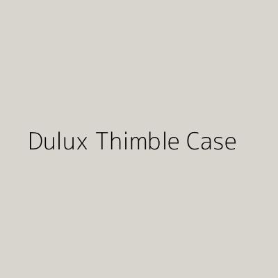 the words dulux thimble case are in black and white on a gray background